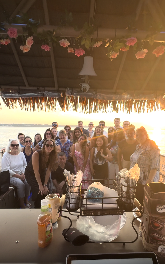 tiki boat group sunset